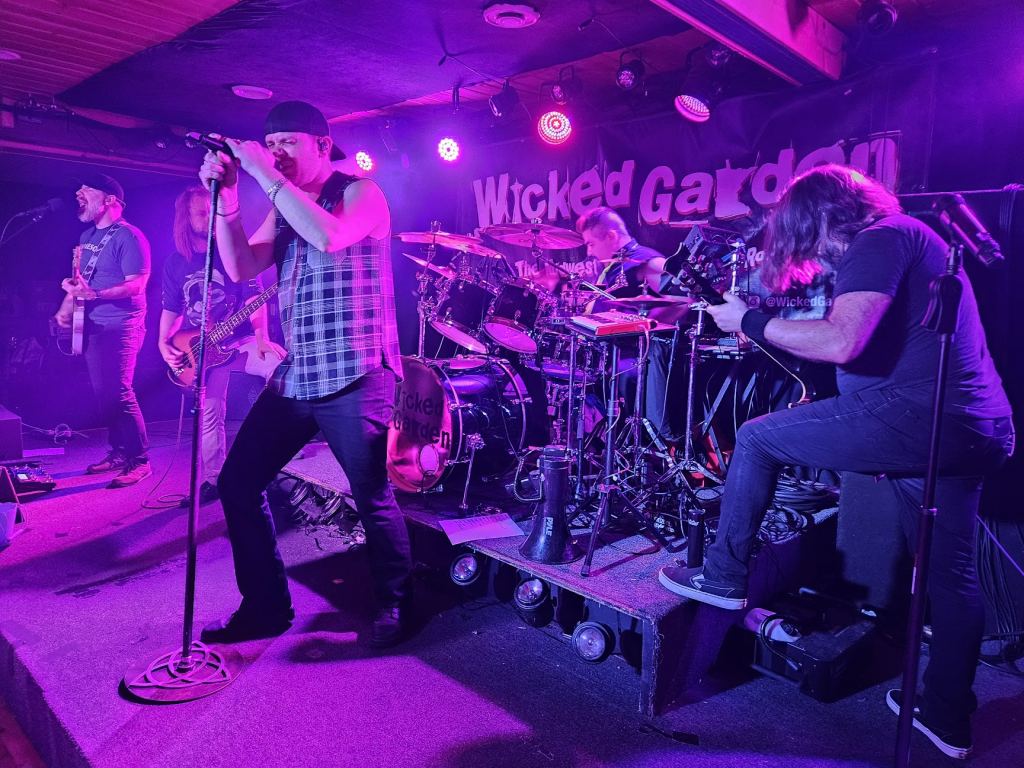 a rock band in mid-performance